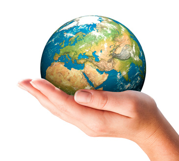 Hand of the person holds globe.